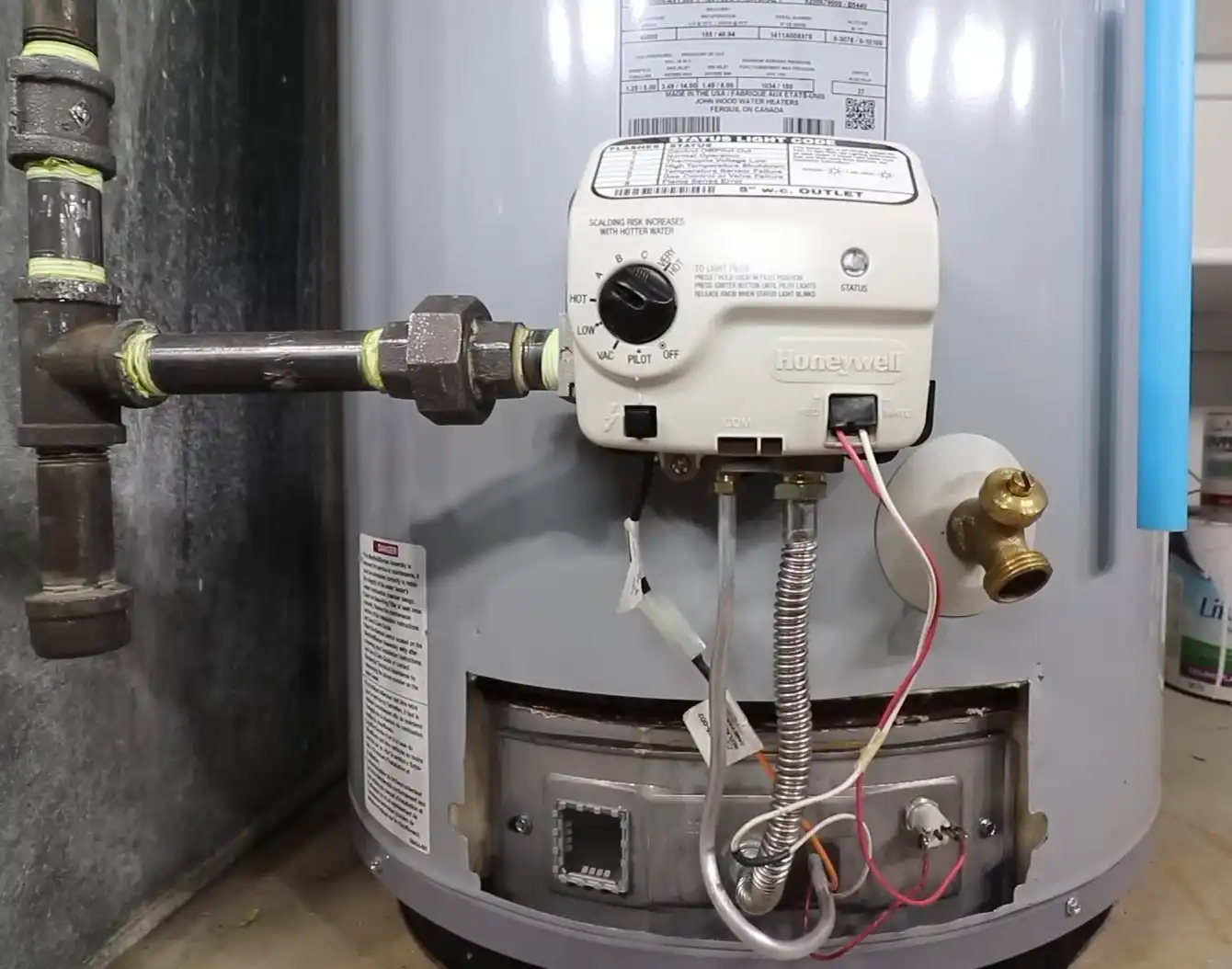 Water heater gas control valve close-up during a repair in Yuma