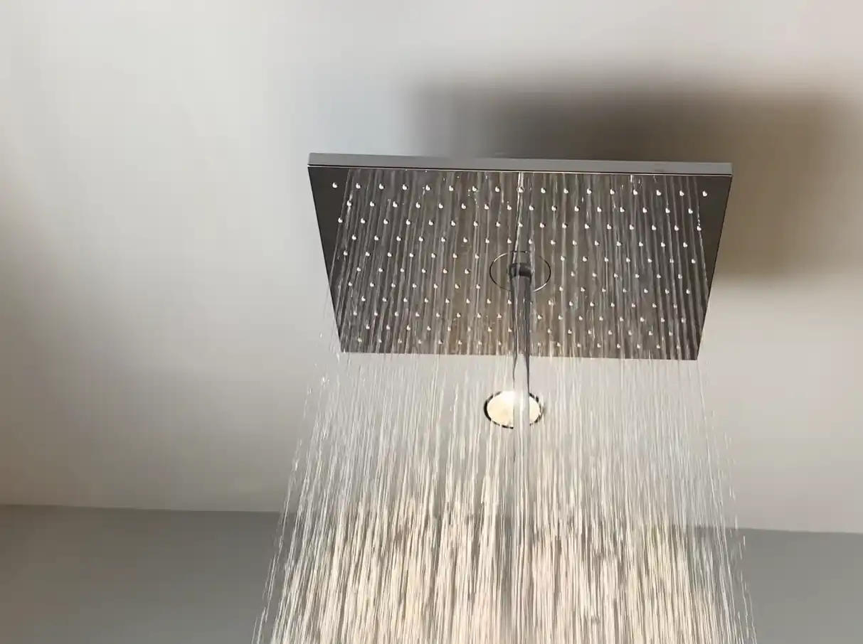Modern rain shower head installed during a bathroom plumbing upgrade